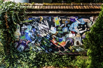 Street art on the wall of a building in the Kazimierz Jewish Quarter, a historically significant,