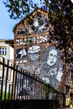 Street art on the wall of a building in the Kazimierz Jewish Quarter, a historically significant,