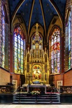 Wyspianski stained glass window and main altar in the presbytery, Franciscan Church, 1249, Krakow,
