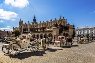 Carriage in front of Rynek with Cloth Hall, from 13th century, Main Market Square, landmark of the