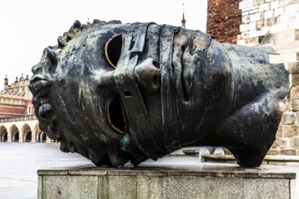 Eros Bendato, modern bronze head, rynek with cloth halls, from 13th century, main market square,