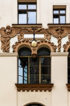 Czyncielow Art Nouveau house façade with intricate terracotta reliefs depicting snakes and an