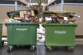 Overfilled paper bins on collection day, Eckental, Middle Franconia, Bavaria, Germany