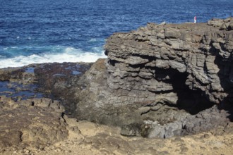Rugged coastal formation with dramatic cliffs and breaking waves, Playa Blanca Lanzarote