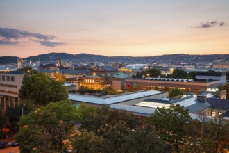 19 Sep 2018 at dusk, glowing city lights illuminate downtown with panoramic view. Stuttgart,