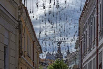 Light bulbs for evening lighting between houses, Cluj-Napoca, Romania