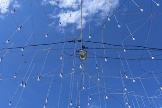 Light bulbs for evening lighting against blue sky, Cluj-Napoca, Transylvania, Romania