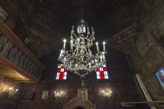 Silver candlestick in the historic wooden Trinity Church, Zhovkva city, Ukraine