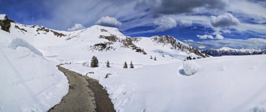 Alpine mountain panorama with hiking trail in snow on the Fellhorn in spring in the Allgäu Alps in