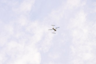 Drone in the sky with scattered clouds as it flies, fiberglass groundbreaking, Freudenstadt,