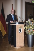 Kai Wegner, Governing Mayor of Berlin, gives a speech in front of a dinner in honor of the honorary