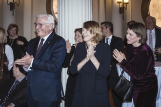Frank-Walter Steinmeier and Elke Büdenbender applaud after a speech by Kai Wegner in front of a