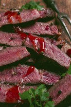 Fried steak, beef steak, rib eye steak, sliced steak, on a chopping board, top view, no people