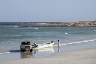 Car pulls fishing boat into sea, Oman