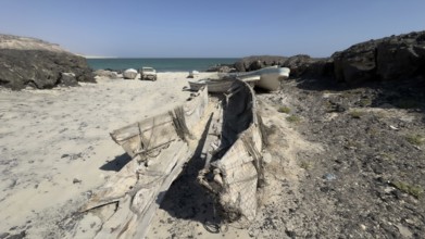 Old fishing boats, fishing village with boats on the beach, near Ras Madrakah, Oman