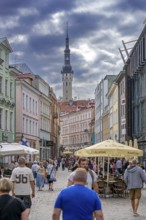 17th century belfry of the town hall and tourists in shopping street of the Old Town of the capital