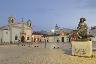 Church of Santa Maria ou da Misericordia and monument to Henry the Navigator at dusk, Praca Infante