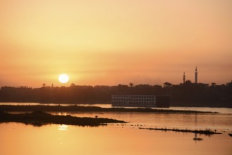 Nile cruise ship at sunset on the Nile, Luxor, Egypt