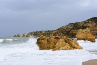 Rocks on the coast in the surf, Praia Dona Ana, Lagos, Algarve, Portugal