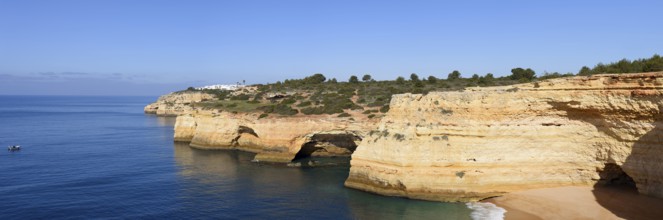 Rocky coast with caves, Praia da Corredoura, Algarve, Portugal