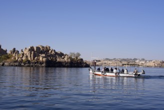 Sightseeing boat with tourists on Lake Nasser, Aswan, Egypt
