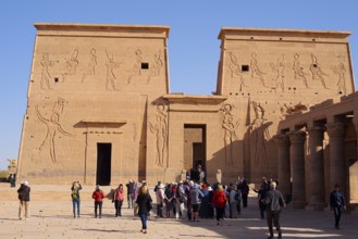 Tourists on the square in front of the first pylon, Isis temple, Philae temple, UNESCO World