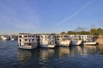 Nile cruise ships at the pier at the double temple of Kom Ombo, Kom Ombo, Egypt