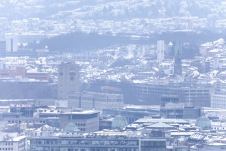 March 18, 2018, winter view with snow toward city center with station and tower from Mount