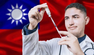 Doctor holding syringe on Taiwan flag background. Medical professional holding syringe with