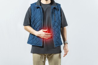 Person with digestive and stomach problems isolated. Unhappy man with digestive problems isolated