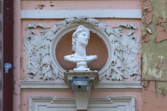 Bust on a dilapidated 19th century house façade, Czernowicz, Ukraine
