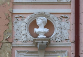 Bust of a woman on a dilapidated 19th century house façade, Czernowicz, Ukraine