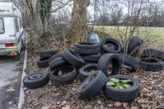 Illegally disposed of car tires and other trash, on a side street in Duisburg-Kaiserberg, North
