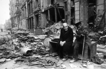 Two blind men sitting on the rubble, Französische Straße in Berlin, Mitte, April 1945 J. Chaldej