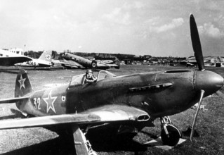 Soviet pilot with plane at Tempelhof Airport in Berlin May, 1945, Germany