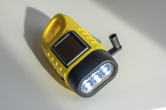 Crank operated flashlight, by turning the crank, we generate electricity in a dynamo, which charges