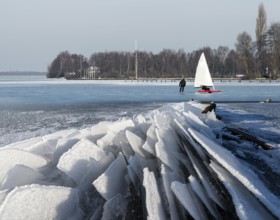 Eisfloes Steinhuder Meer winter with ice sailor and skater Steinhude Germany