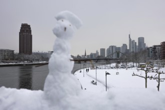 There is snow on the banks of the Main from the Wesel shipyard to the Frankfurt banking skyline,