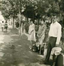 Historical photo summer 1961, tourists in front of returning home at Rimini train station, Rimini,