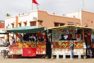 Stalls selling freshly squeezed fruit juices and smoothies on the Djemaa el Fna juggler square,