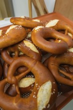 Fresh pretzels with salt on them, the surface is golden brown, bake rolls, Haselstaller Hof,