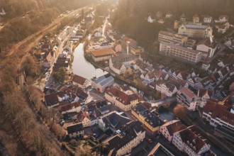 City view with river and buildings in sunlight from a bird's eye view, measurement trip on the new