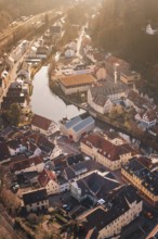 Historic city on a river, surrounded by trees and old buildings, test trip on the new Hermann-Hesse