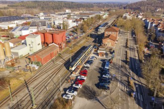 Industrial area with freight yard, parked vehicles and rails, test run on the new Hermann-Hesse