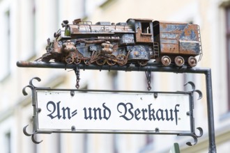 Advertising sign with a model of a steam locomotive for purchase and sale, Chemnitz, Saxony,
