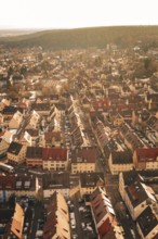 Overview of an urban landscape with densely packed houses and snow-covered roads, Freudenstadt,