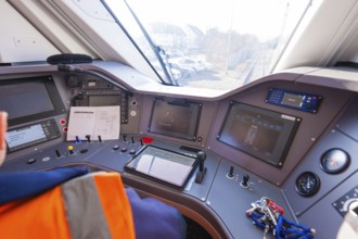 Train driver cabin with control panels and monitors for monitoring, test run on the new