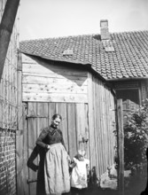 Woman and little girl posing for photo, ca. 1920-1930, retro, vintage, old, historic, northern