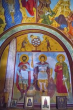 Orthodox icons and frescoes depicting religious figures and colors in a church, Nikorzminda