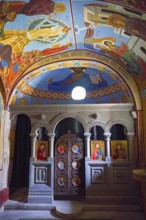 Colourful altar area of an Orthodox chapel with frescoes and icons, Nikorzminda Cathedral,
